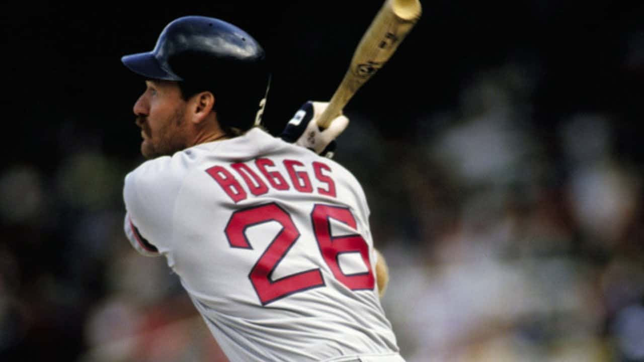 11 Third Basemen Who Owned the '90s 4 Wade Boggs showcasing his batting prowess as a dominant MLB star of the 1980s.