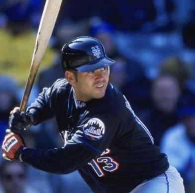 The Supporting Cast That Made Pedro Martinez's Career Feel Like Cinema 3 Edgardo Alfonzo in action, showcasing his clutch hitting for the Mets.