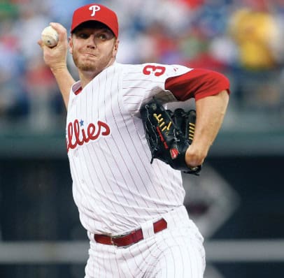 Roy Halladay pitching, a key figure in "12 Baseball Legends Who Left the Diamond Too Soon."