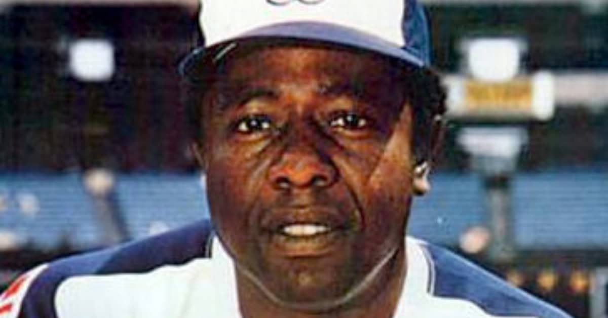 Game 7, Two Outs, Full Count — Please, Not These 10 Hitters 4 Hank Aaron in action, highlighting his incredible 2,297 career RBIs in baseball.