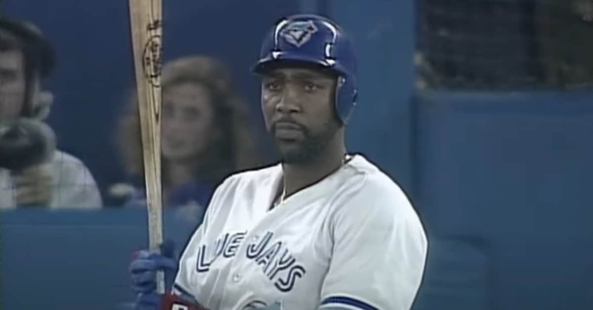 20 Blue Jays Who Deserved a Plaque in Cooperstown 14 Joe Carter swinging during a game, highlighting his historic homer and stats.