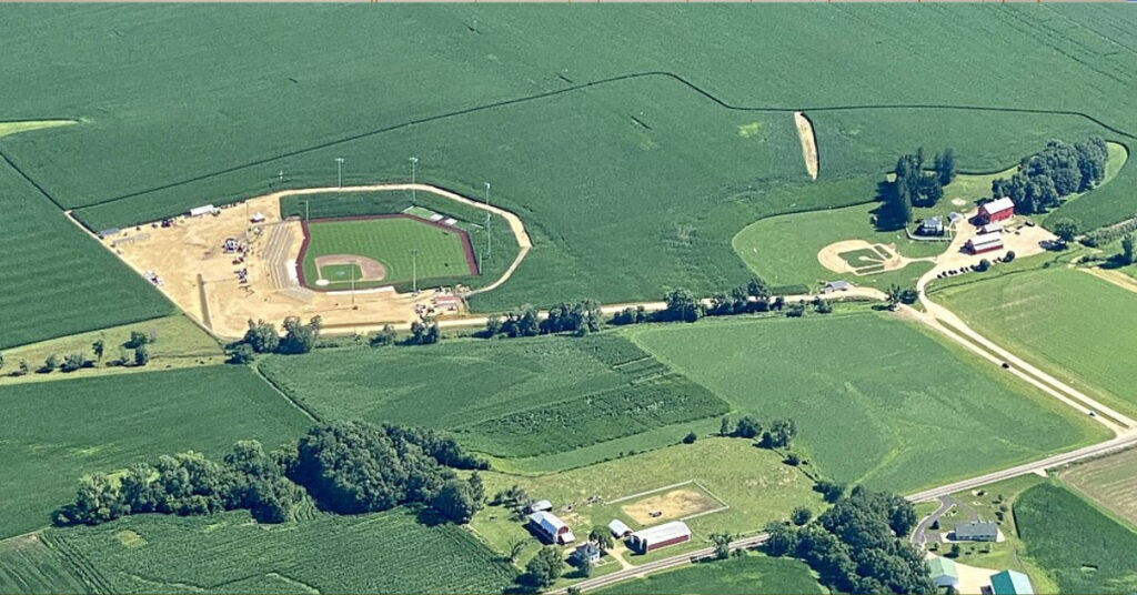 How a Cornfield Became the Most Magical Ballpark in America 2 two baseball fields out in a cornfield aerial view. With smaller barns.