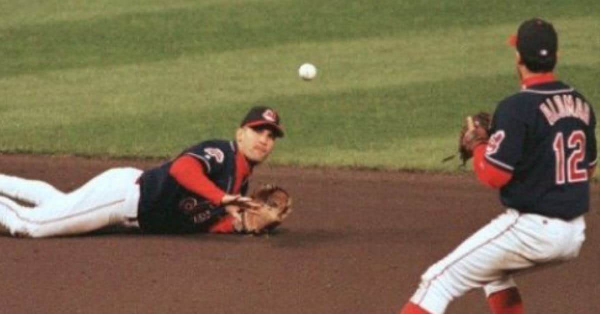 They Looked Better Than They Measured 11 Roberto Alomar and Omar Vizquel, iconic MLB double-play partners, showcasing their defensive skills.