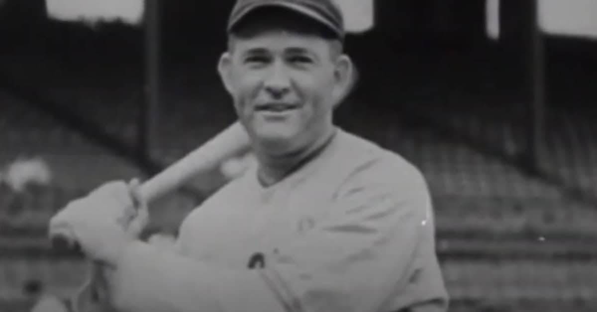 Rogers Hornsby in action, showcasing his unparalleled .424 season, a record unlikely to be broken.