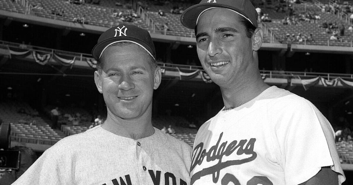Whitey Ford and Sandy Koufax share a moment, embodying sportsmanship and integrity.