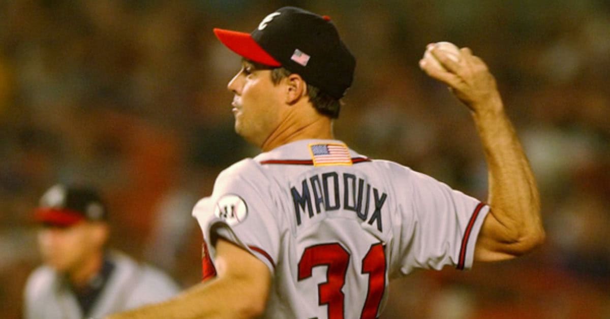How Greg Maddux Turned Pitching into an Exact Science 4 Greg Maddux delivering a pitch during a tense playoff game, showcasing his exceptional skills.