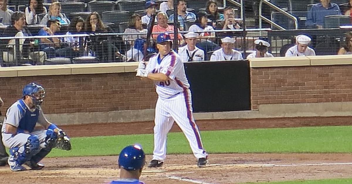 Bartolo Colon swings at the plate, illustrating the DH rule's effect on player roles.