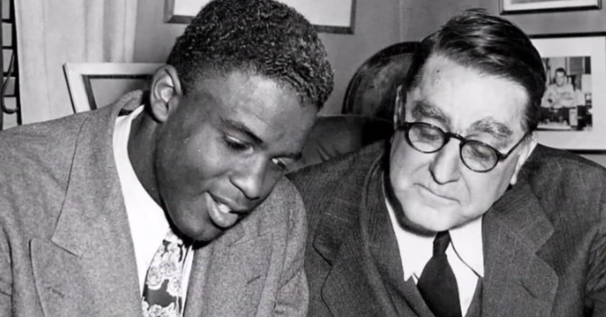 The GMs Who Actually Built Something 2 Jackie Robinson and Branch Rickey together, symbolizing courage in baseball history.
