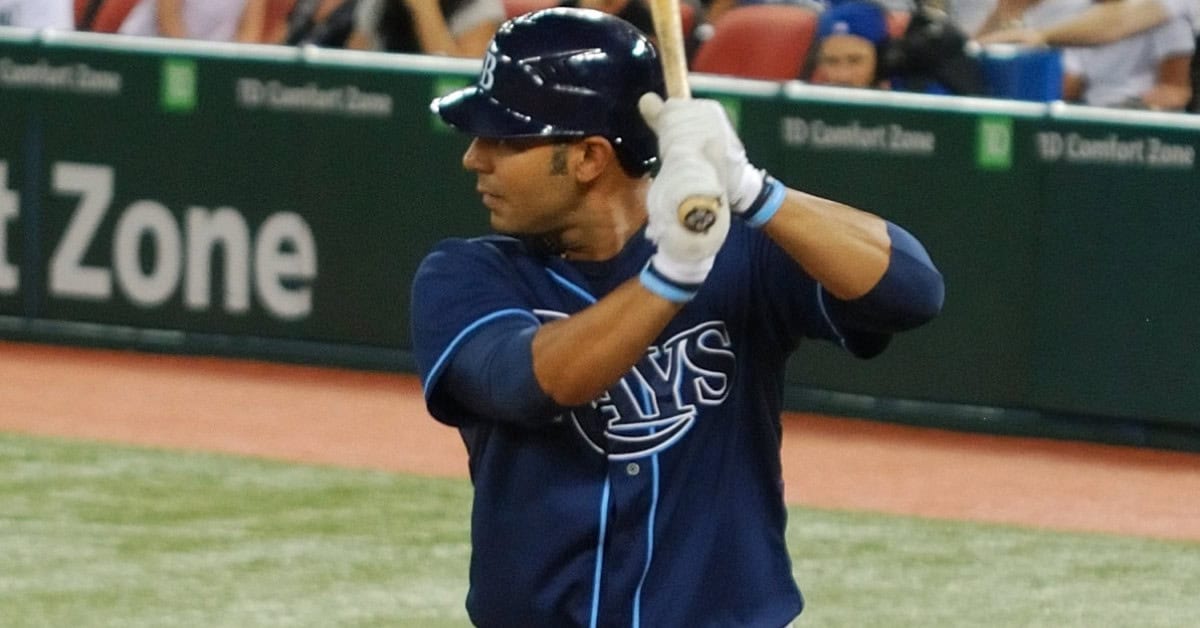 Forgotten Bombers: 10 Power Hitters the 2000s Quietly Buried 8 Carlos Peña swings for a home run, embodying Rays' spirit from "Rainbow to Sunburst."