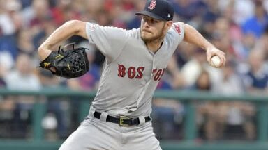 The 22-Ace Ceiling: Pitching's True Elite, No Compromises 23 Chris Sale delivering a powerful pitch, showcasing his strikeout prowess as detailed in "The Greatest Pitchers of the 2010s."