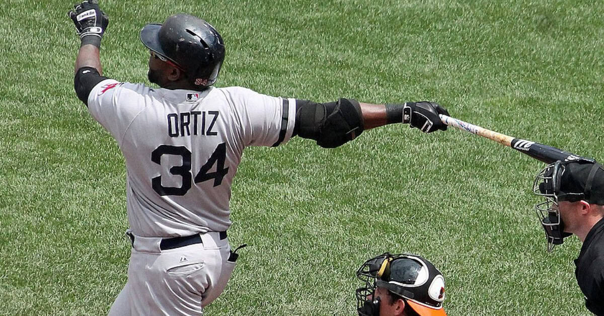 The Supporting Cast That Made Pedro Martinez's Career Feel Like Cinema 21 David Ortiz at bat, symbolizing the impact of the designated hitter rule in baseball.