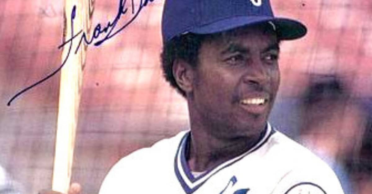 Frank White, a legendary second baseman, showcasing his defensive skills.