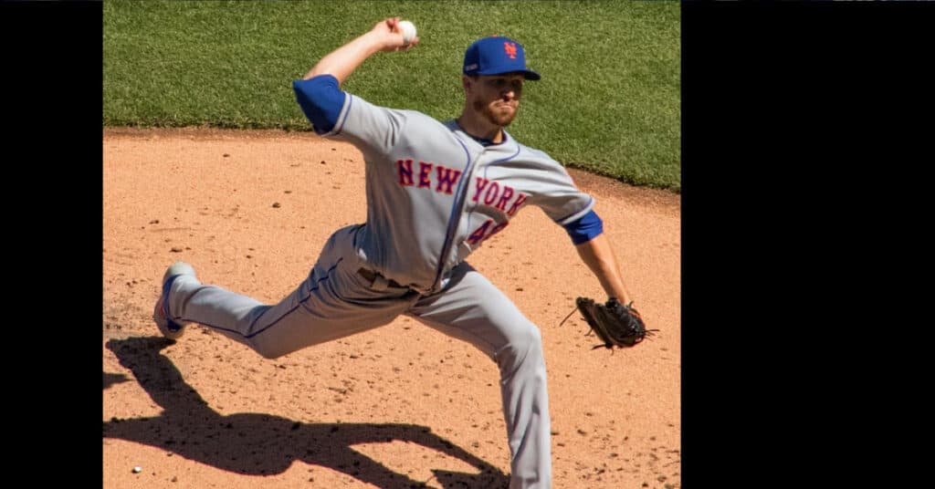 The 22-Ace Ceiling: Pitching's True Elite, No Compromises 10 Jacob deGrom in Mets Uniform. In windup throwing a pitch.
