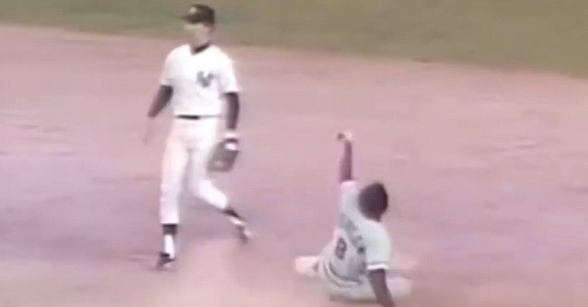 Joe Morgan Was Undersized and Unstoppable — The Numbers Prove It 3 Joe Morgan in action, showcasing his legendary speed and base-stealing skills.