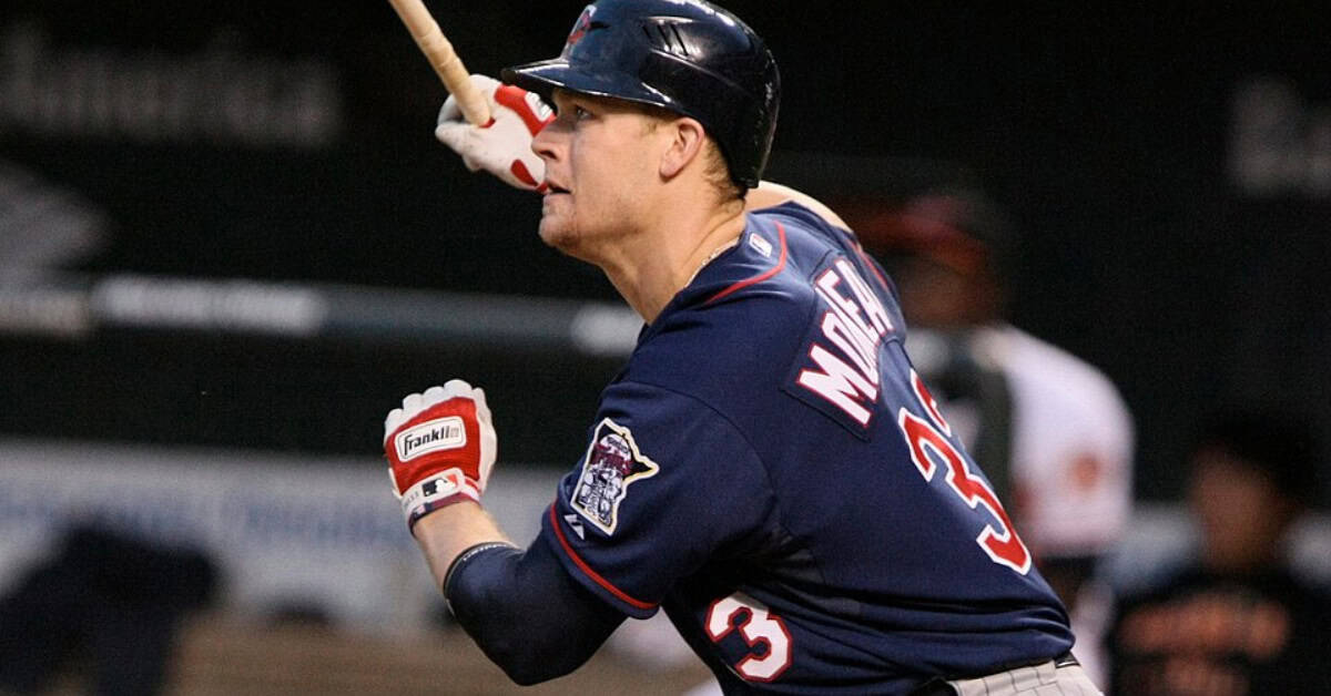 25 Minnesota Twins Worth Remembering 16 Justin Morneau hitting a home run, showcasing his power for the Twins.