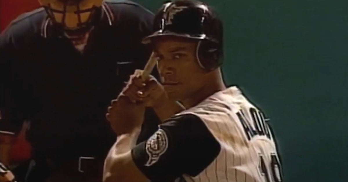 Moises Alou celebrating a pivotal moment in the '97 Series, showcasing his impact on South Florida baseball.