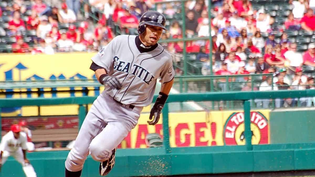 Ichiro Suzuki sprinting to home plate, showcasing his remarkable speed and skill.