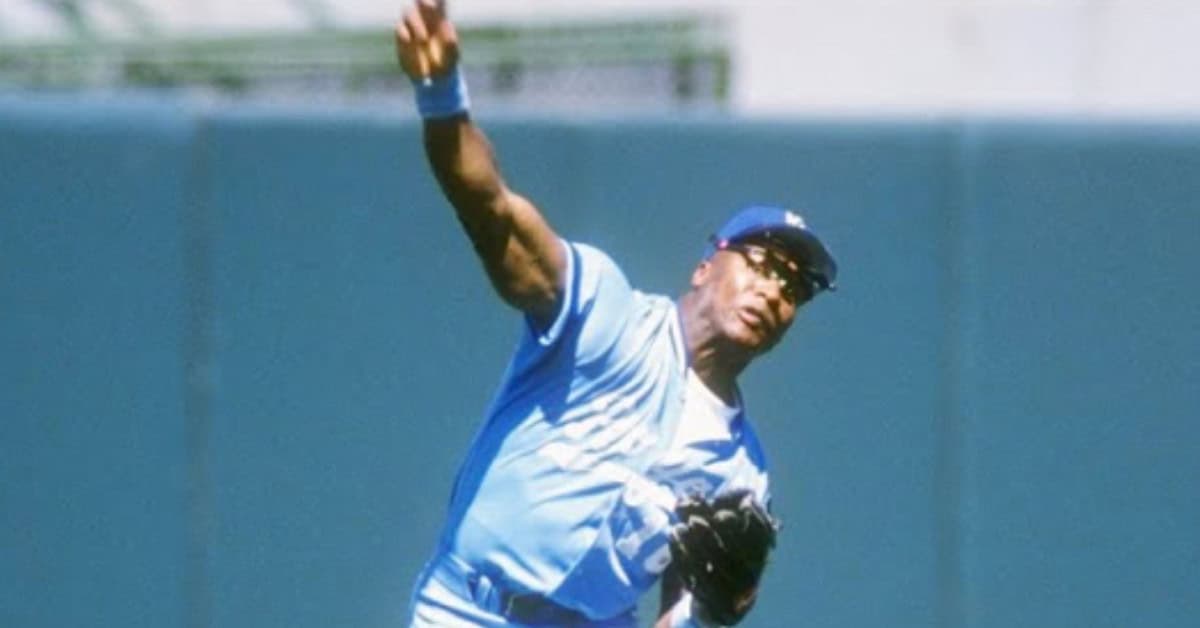 Bo Jackson showcasing his cannon arm while fielding in the outfield.