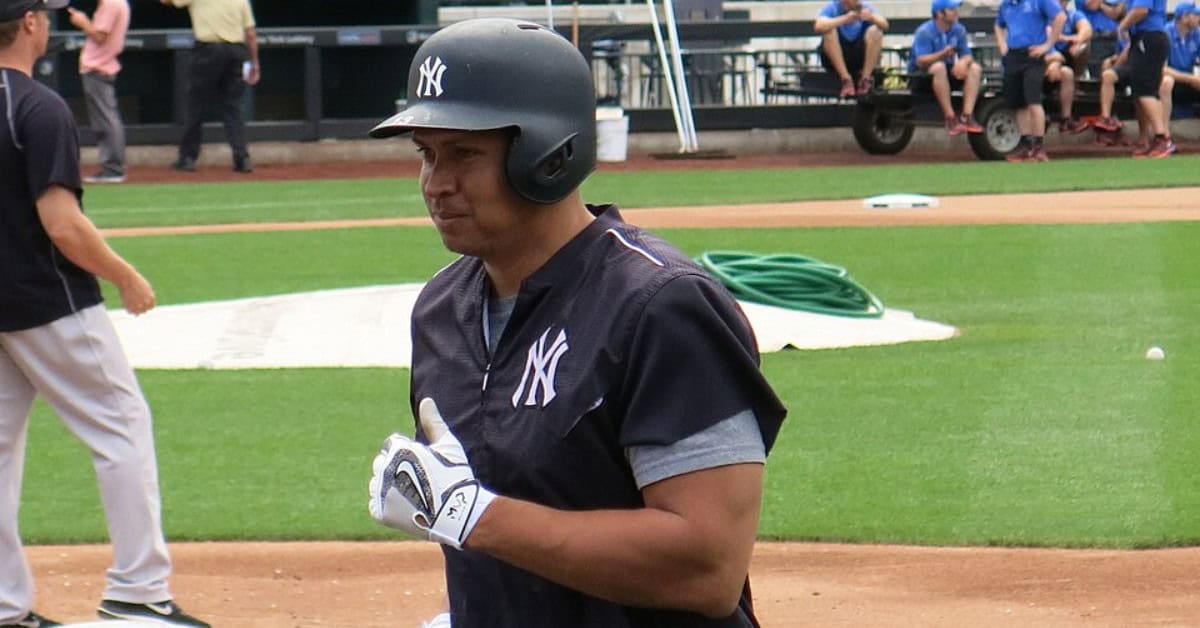 Alex Rodriguez hitting a home run, showcasing his power at Citi Field.