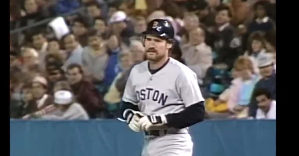 The 25 Men Who Made Fenway Sacred 21 Wade Boggs standing on first base, showcasing his exceptional hitting skills and .328 career average.