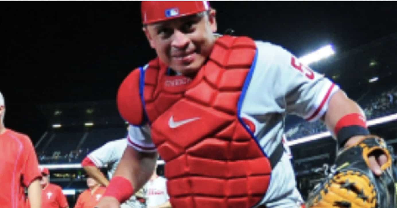Carlos Ruiz in action, representing his legacy as a top MLB catcher in the post.