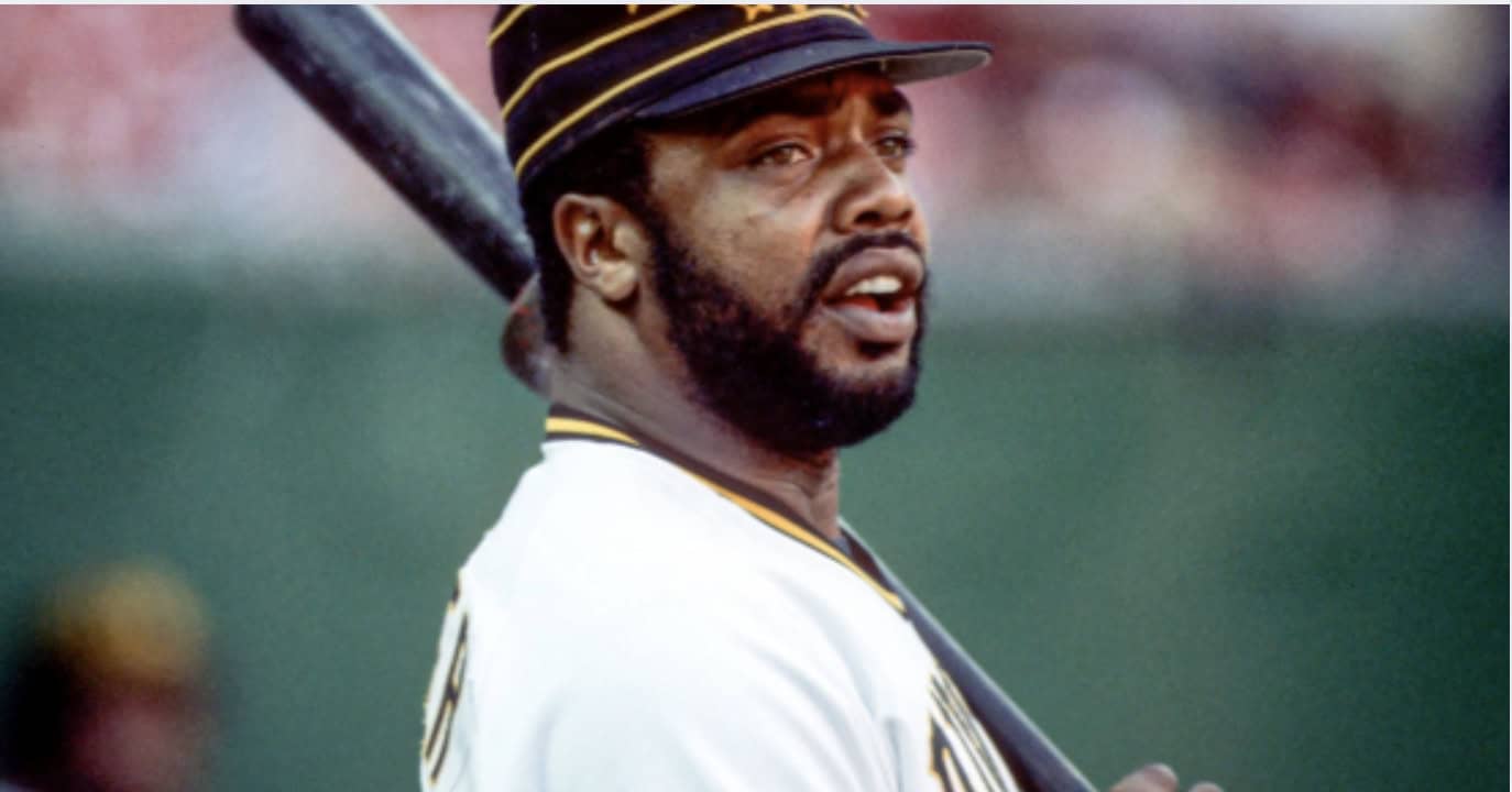 Image of Dave Parker showcasing his defensive skills, linked to his Gold Glove awards.