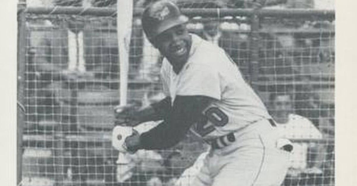 Meet the 20 World Series Heroes Who Defined a Turbulent Decade 12 Frank Robinson in action, showcasing his Triple Crown-winning prowess in baseball.