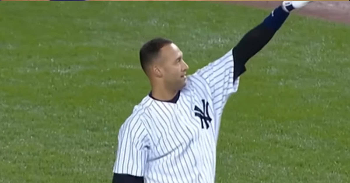 Derek Jeter waves to the crowd, celebrating his record 2,747 games as a Yankee.