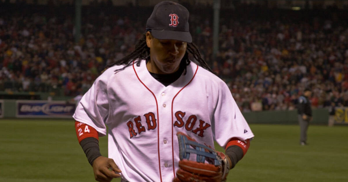 The Supporting Cast That Made Pedro Martinez's Career Feel Like Cinema 20 Manny Ramirez in action, embodying the spirit of transcending excellence in baseball.