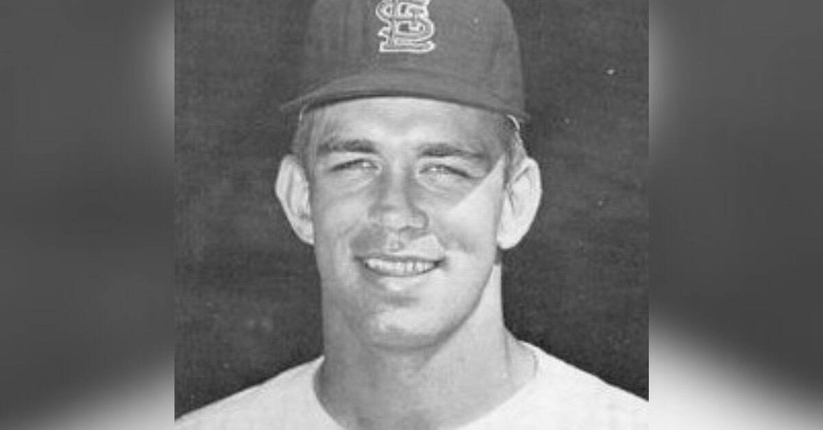 Tim McCarver catching for the Cardinals, showcasing his skill and resilience.