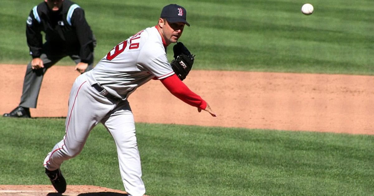 The Supporting Cast That Made Pedro Martinez's Career Feel Like Cinema 4 Tim Wakefield throwing a knuckleball, showcasing his unique pitching style.