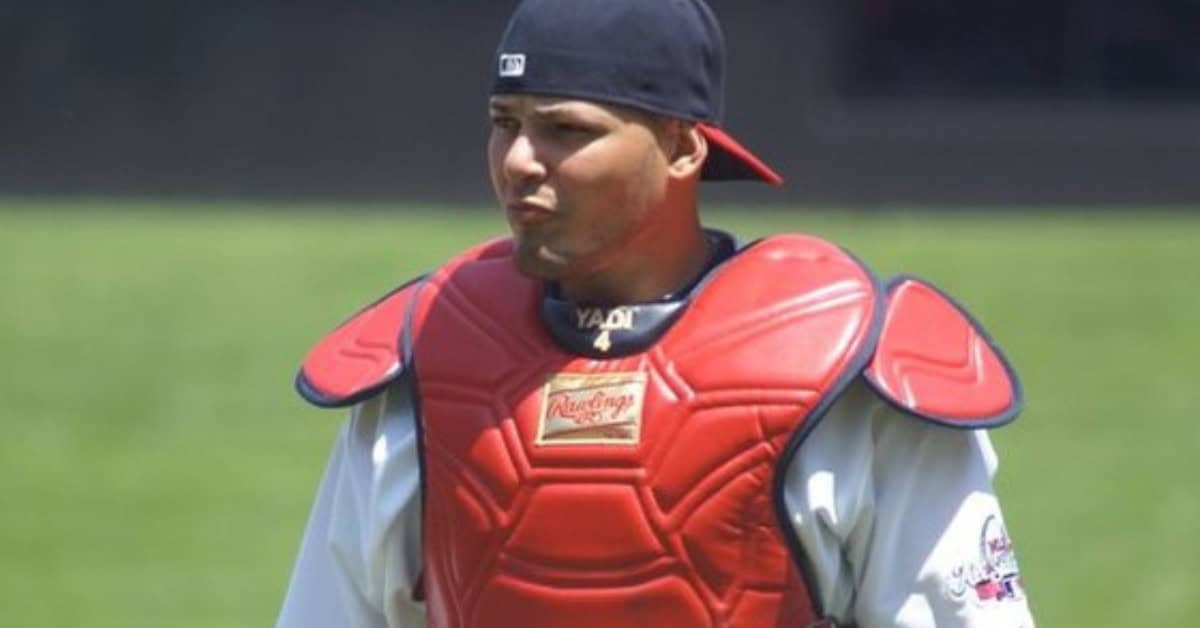 Yadier Molina skillfully framing a pitch, showcasing his genius in defense.