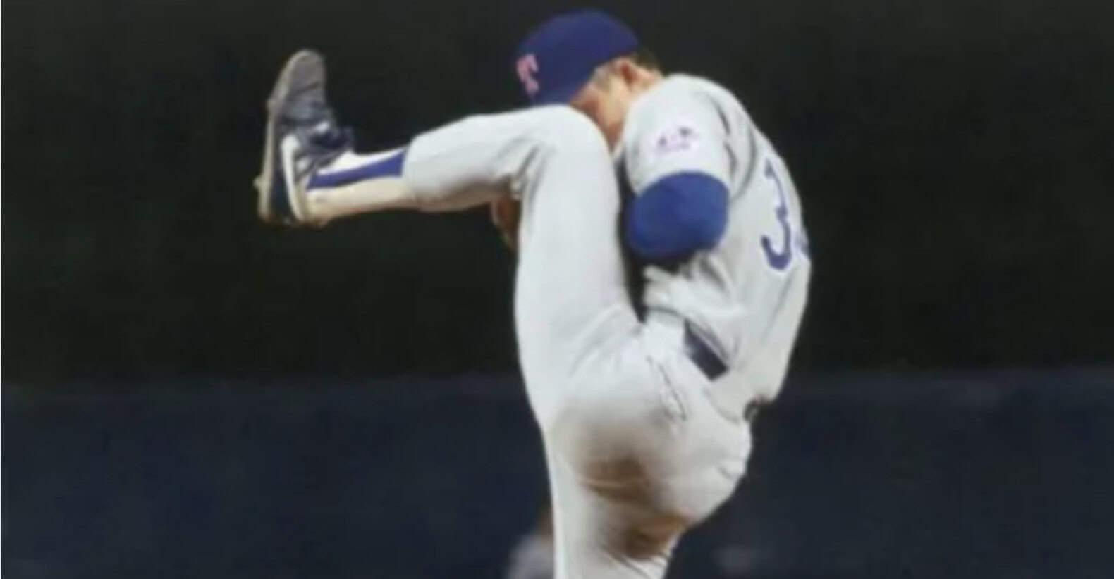 Nolan Ryan pitching during one of his seven no-hitters, showcasing his dominance in MLB.