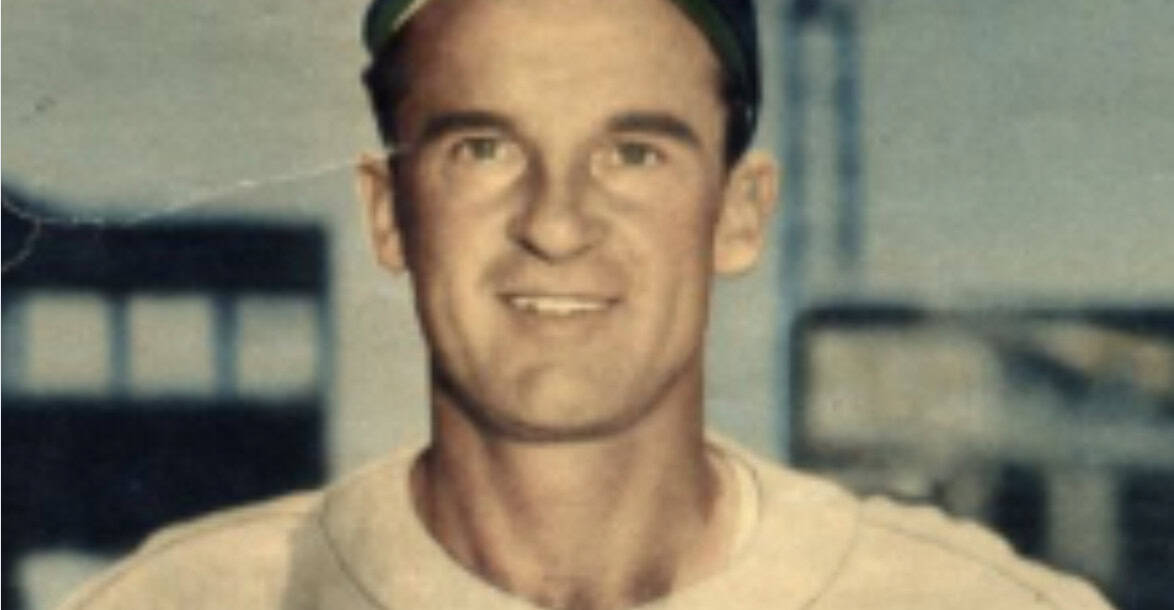 George McQuinn at bat, showcasing his talent during the 1940s MLB era.