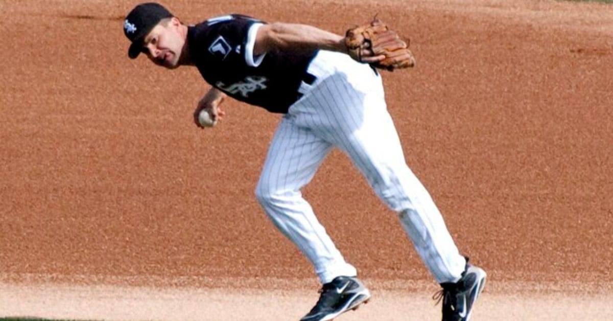Meet the Shortstops Who Made Jeremy Peña Possible 7 Omar Vizquel fielding a ground ball, showcasing his defensive prowess.
