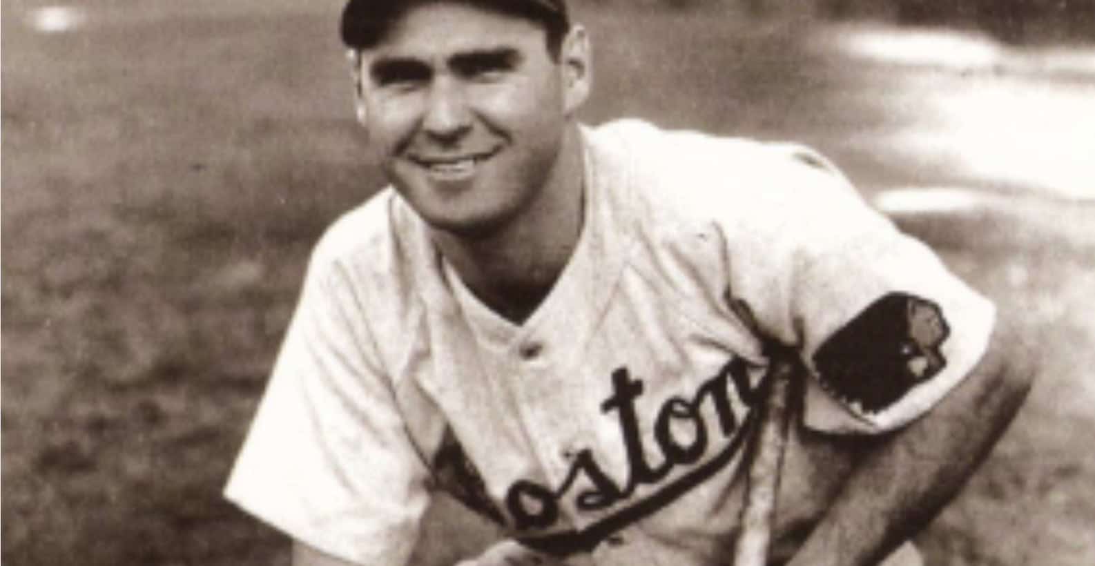 Tommy Holmes, a standout right fielder of the 1940s, showcasing his batting prowess.