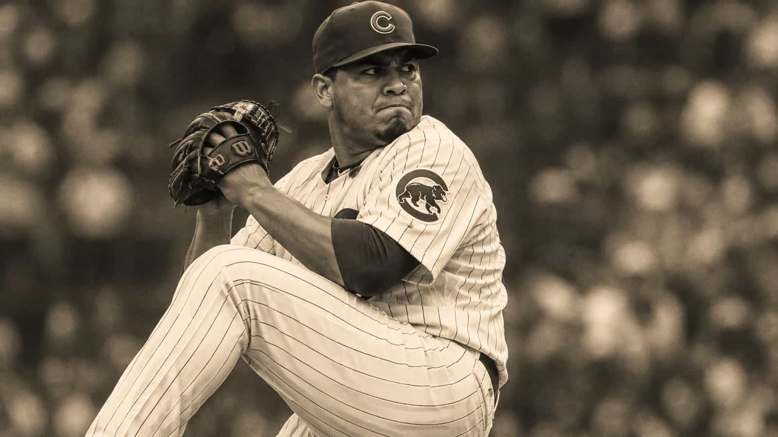 Duotone vintage-style image of Carlos Zambrano of the Chicago Cubs delivering a pitch with intense expression
